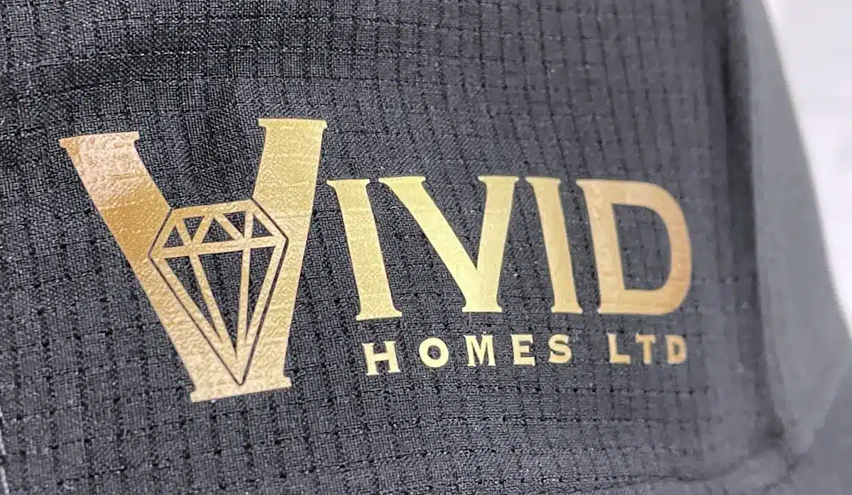 Custom-Branded Apparel for Vivid Homes - Hats with Heat Press Logo - Closeup