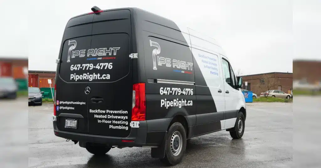 Van Graphics after design and installation for Pipe Right Plumbing and Hydronics, rear passenger view.