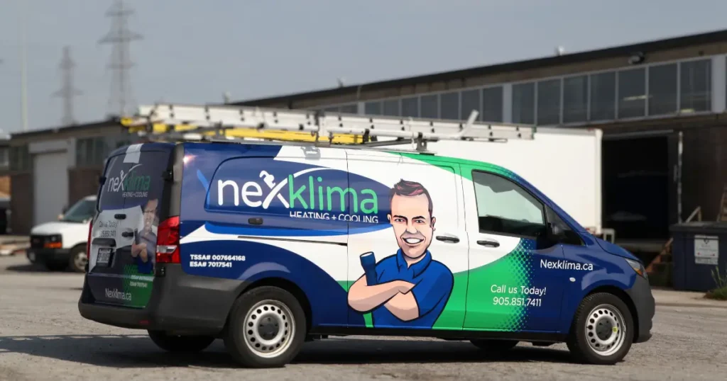 Side view of Nexklima's company vehicle, displaying customized decals