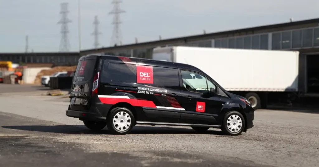 Side view of a Ford Transit displaying decalings