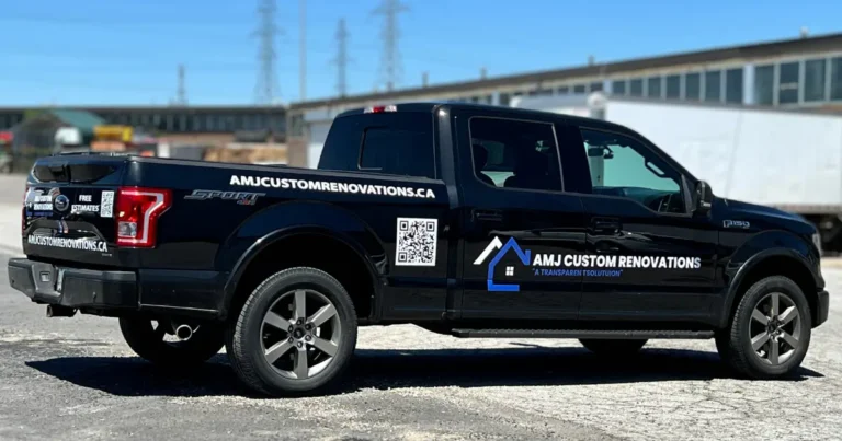 Side shot of a Ford F-150 2015, displaying AMJ Custom Renovations decals