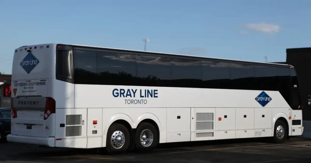 Gray Line vibrant decals displayed on a Prevost Coach Bus