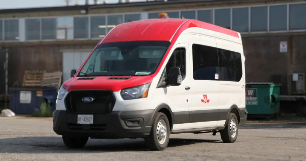 Front view of a Ford Transit 350 showcased with partial wrap