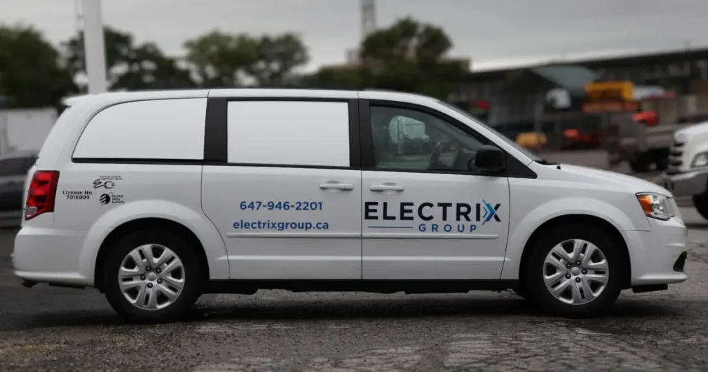 Side view of a Dodge Caravan 2017 displayed with decals