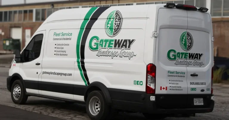 Side view of a Gateway company's Ford transit displayed with a partial wrap