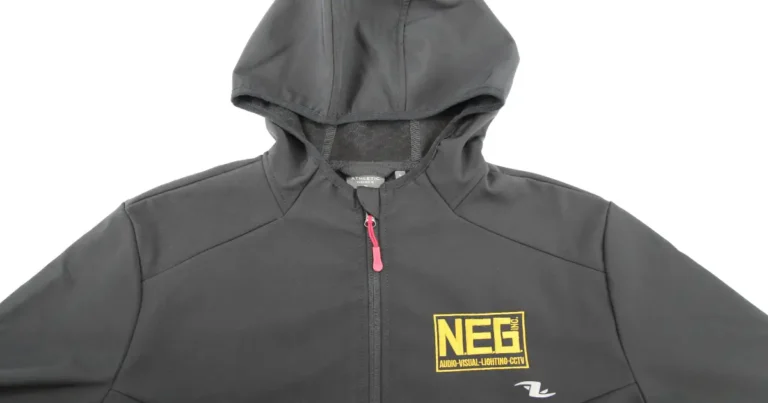 Neg Inc logo embroidered on a zip-up sweater